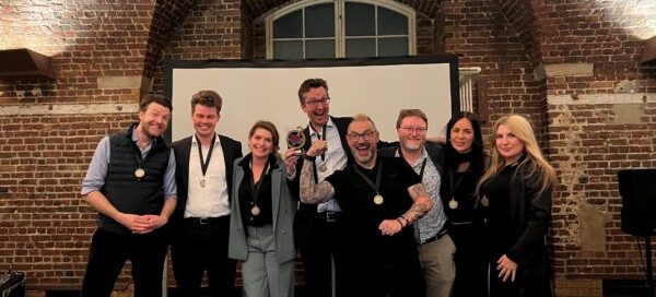 Astraea Linskills team celebrating their victory at the 5RB Quiz event, symbolizing teamwork and success.